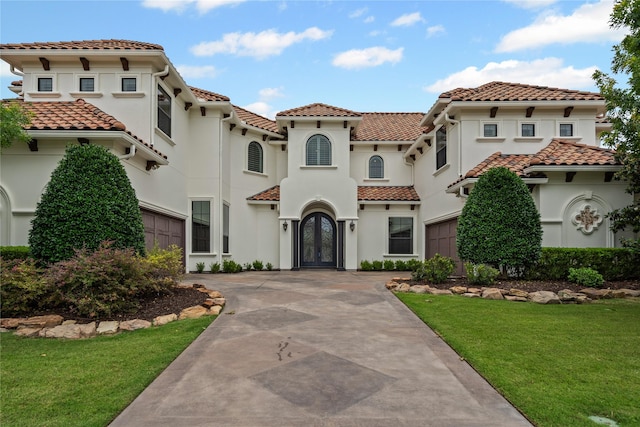 10388 Tobias Ln, Frisco, TX 75033 - mediterranean / spanish-style house featuring concrete driveway, a tiled roof, french doors, and a garage