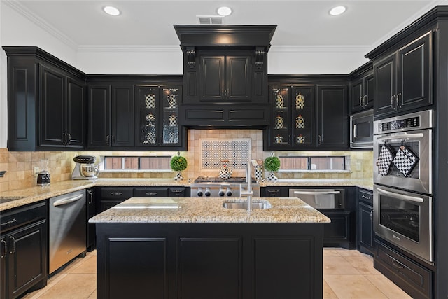 10388 Tobias Ln, Frisco, TX 75033 - kitchen with dark cabinets, stainless steel appliances, light tile patterned flooring, a warming drawer, and ornamental molding