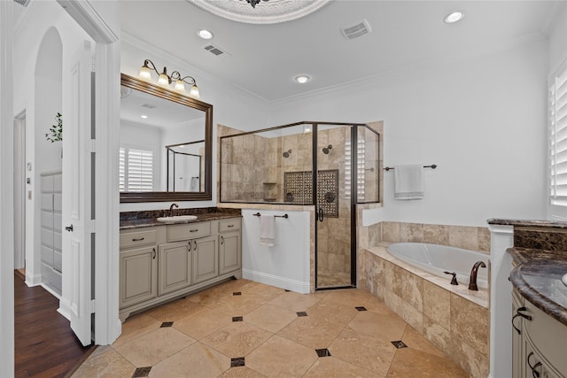 10388 Tobias Ln, Frisco, TX 75033 - bathroom with vanity, a bath, a shower stall, crown molding, and recessed lighting