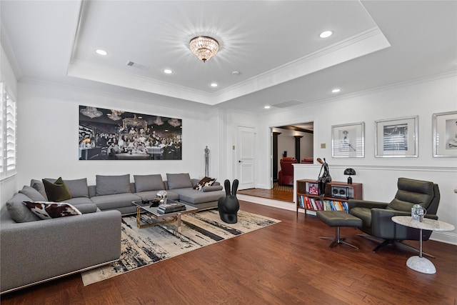 10388 Tobias Ln, Frisco, TX 75033 - living room with wood finished floors, crown molding, a raised ceiling, and recessed lighting