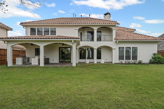 10388 Tobias Ln, Frisco, TX 75033 - rear view of property with a ceiling fan, a chimney, a tiled roof, a balcony, and stucco siding