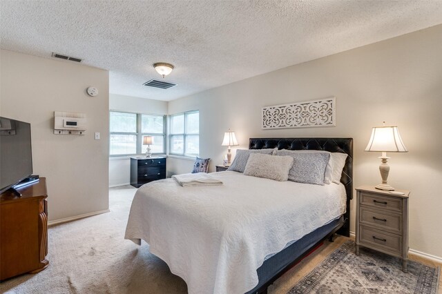 3601 Scranton Dr, Richland Hills, TX 76118 - carpeted bedroom featuring a textured ceiling and baseboards