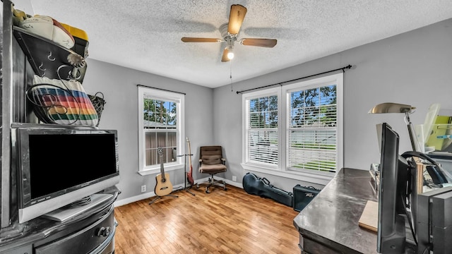 1007 SE 24th St, Mineral Wells, TX 76067 - office area with a ceiling fan, light wood-style flooring, a textured ceiling, and baseboards