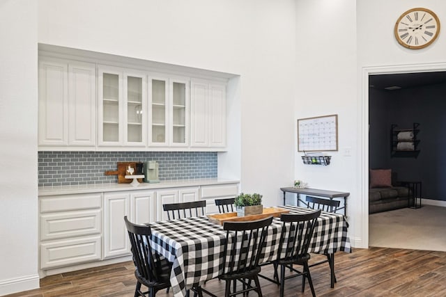 2816 Middleton Dr, Melissa, TX 75454 - dining space featuring dark wood-type flooring, baseboards, and a high ceiling