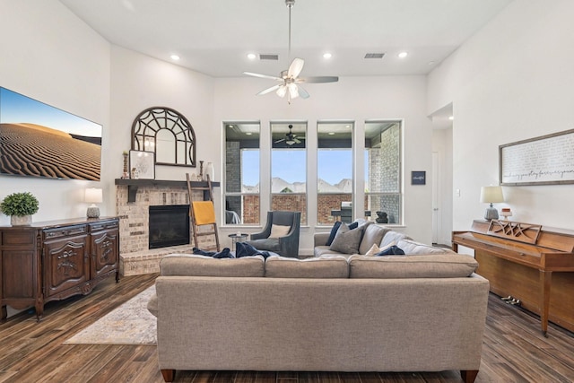 2816 Middleton Dr, Melissa, TX 75454 - living area featuring a ceiling fan, a fireplace, dark wood-type flooring, and recessed lighting