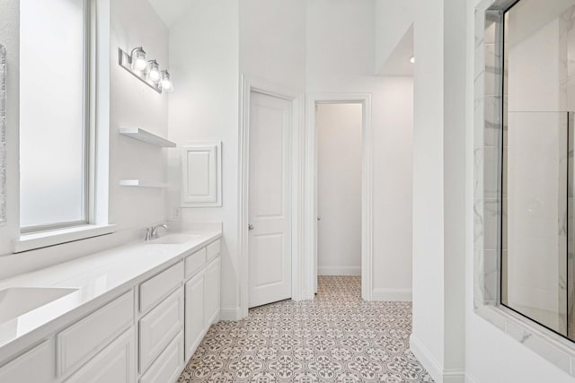 2816 Middleton Dr, Melissa, TX 75454 - bathroom with double vanity, baseboards, and tile patterned floors