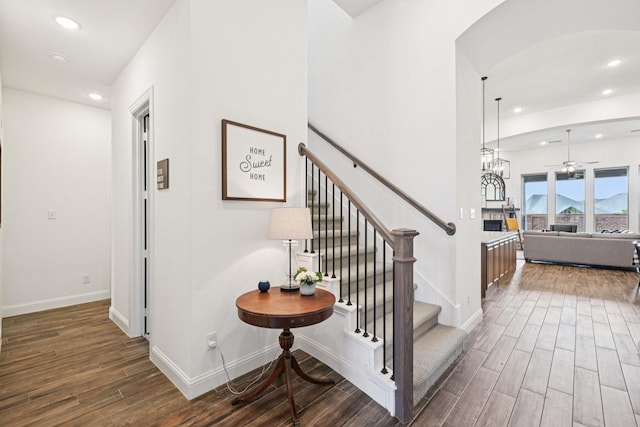 2816 Middleton Dr, Melissa, TX 75454 - staircase with wood finished floors, recessed lighting, baseboards, a ceiling fan, and arched walkways