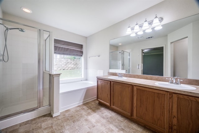 3901 Luck Hole Dr, Denton, TX 76210 - full bathroom featuring a stall shower, a bath, and double vanity