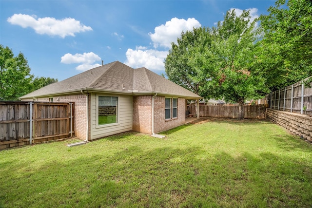 3901 Luck Hole Dr, Denton, TX 76210 - rear view of house with brick siding and roof with shingles