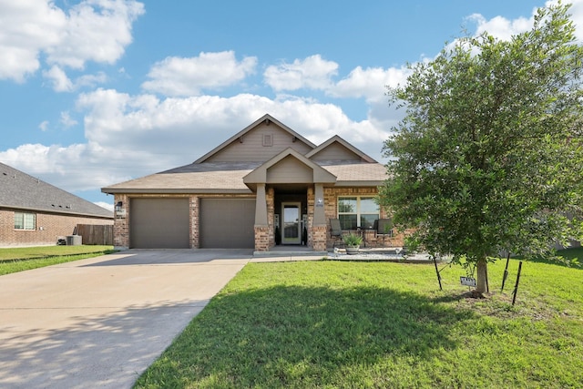 147 Cantle, Waxahachie, TX 75165 - craftsman-style home featuring an attached garage, driveway, a front yard, and brick siding