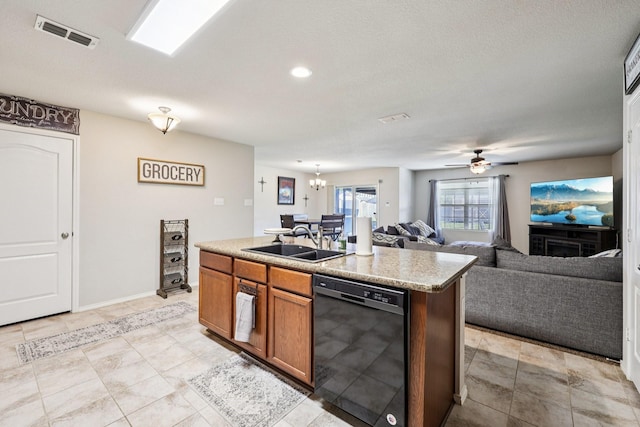 147 Cantle, Waxahachie, TX 75165 - kitchen with black dishwasher, a sink, open floor plan, brown cabinets, and ceiling fan