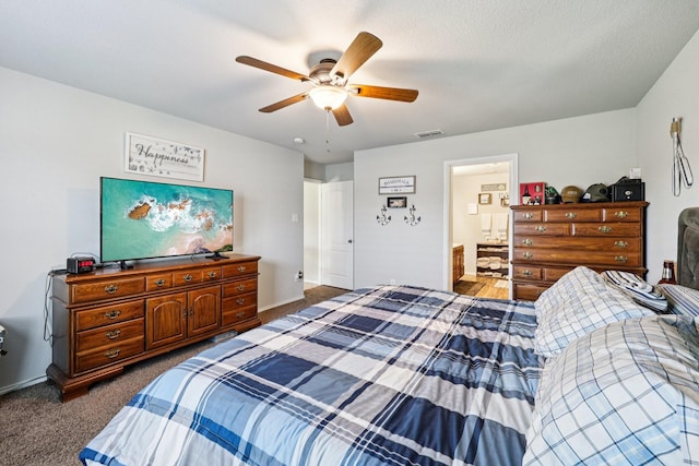147 Cantle, Waxahachie, TX 75165 - bedroom with dark carpet, baseboards, ceiling fan, and ensuite bathroom