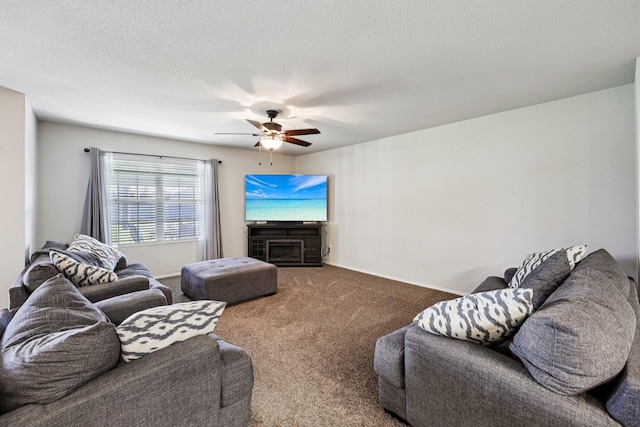 147 Cantle, Waxahachie, TX 75165 - carpeted living room with a ceiling fan, a fireplace, and a textured ceiling