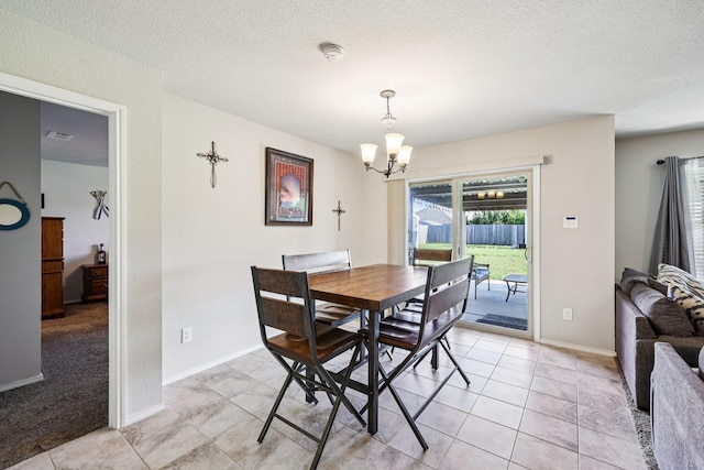 147 Cantle, Waxahachie, TX 75165 - dining space featuring a chandelier, a textured ceiling, light tile patterned floors, and baseboards