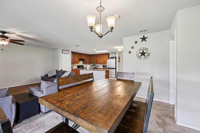 147 Cantle, Waxahachie, TX 75165 - dining space featuring a chandelier, a ceiling fan, baseboards, and light tile patterned flooring