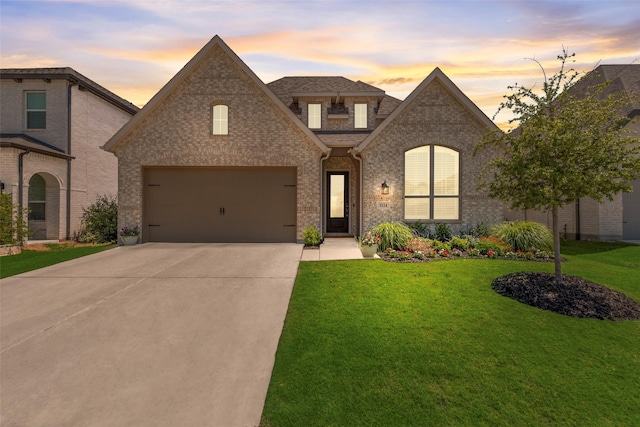 1124 Firecracker Dr, Justin, TX 76247 - french country style house featuring driveway, brick siding, a lawn, and a shingled roof