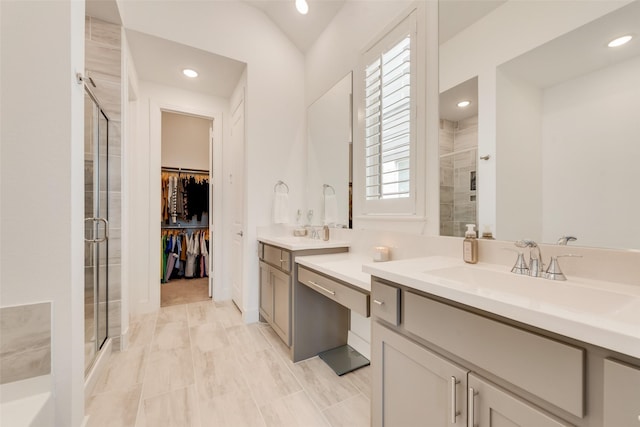 1124 Firecracker Dr, Justin, TX 76247 - bathroom with a shower stall, vanity, a walk in closet, and recessed lighting
