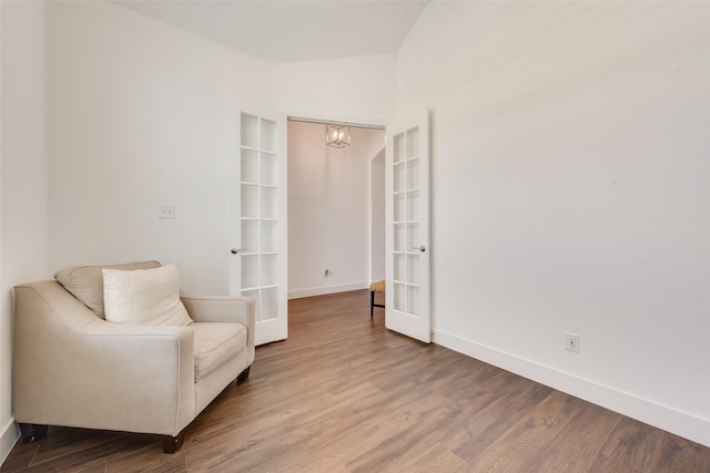 1124 Firecracker Dr, Justin, TX 76247 - sitting room with french doors, wood finished floors, baseboards, and a chandelier