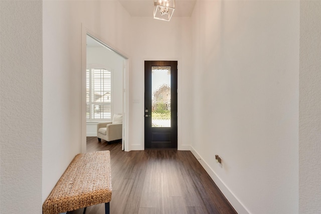 1124 Firecracker Dr, Justin, TX 76247 - entryway featuring a chandelier, dark wood-style floors, and baseboards