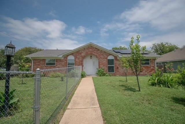 301 Patricia St, Lacy Lakeview, TX 76705 - single story home with brick siding and roof mounted solar panels
