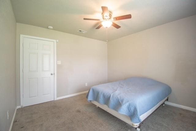 301 Patricia St, Lacy Lakeview, TX 76705 - carpeted bedroom with baseboards and a ceiling fan