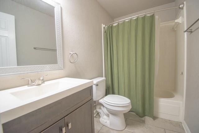 301 Patricia St, Lacy Lakeview, TX 76705 - bathroom featuring vanity, shower / bath combo with shower curtain, toilet, and tile patterned floors