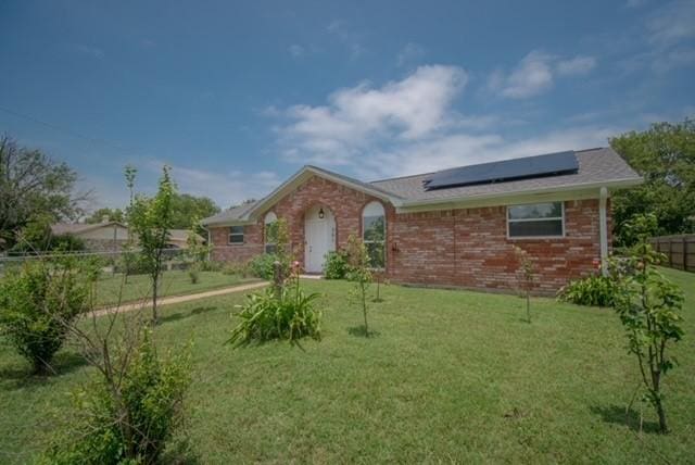 301 Patricia St, Lacy Lakeview, TX 76705 - ranch-style home featuring solar panels and brick siding