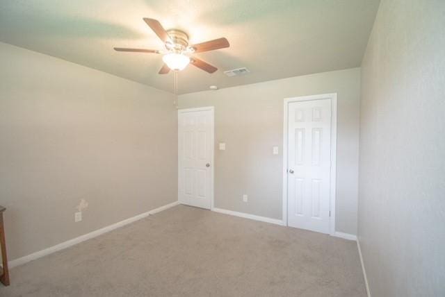 301 Patricia St, Lacy Lakeview, TX 76705 - unfurnished bedroom with carpet flooring, baseboards, and a ceiling fan