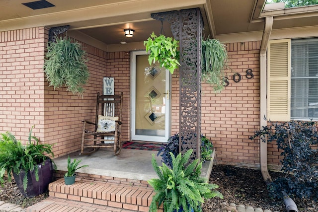 808 S Main St, Winnsboro, TX 75494 - doorway to property with brick siding and covered porch