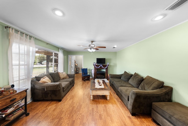 808 S Main St, Winnsboro, TX 75494 - living room featuring light wood-style floors, ceiling fan, recessed lighting, and crown molding