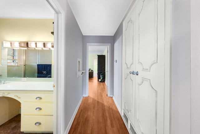 808 S Main St, Winnsboro, TX 75494 - corridor with wood finished floors and baseboards