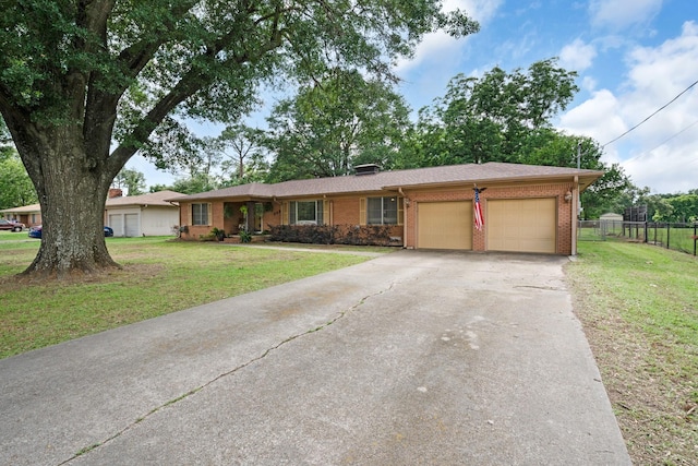 808 S Main St, Winnsboro, TX 75494 - single story home with a garage, asphalt driveway, and brick siding