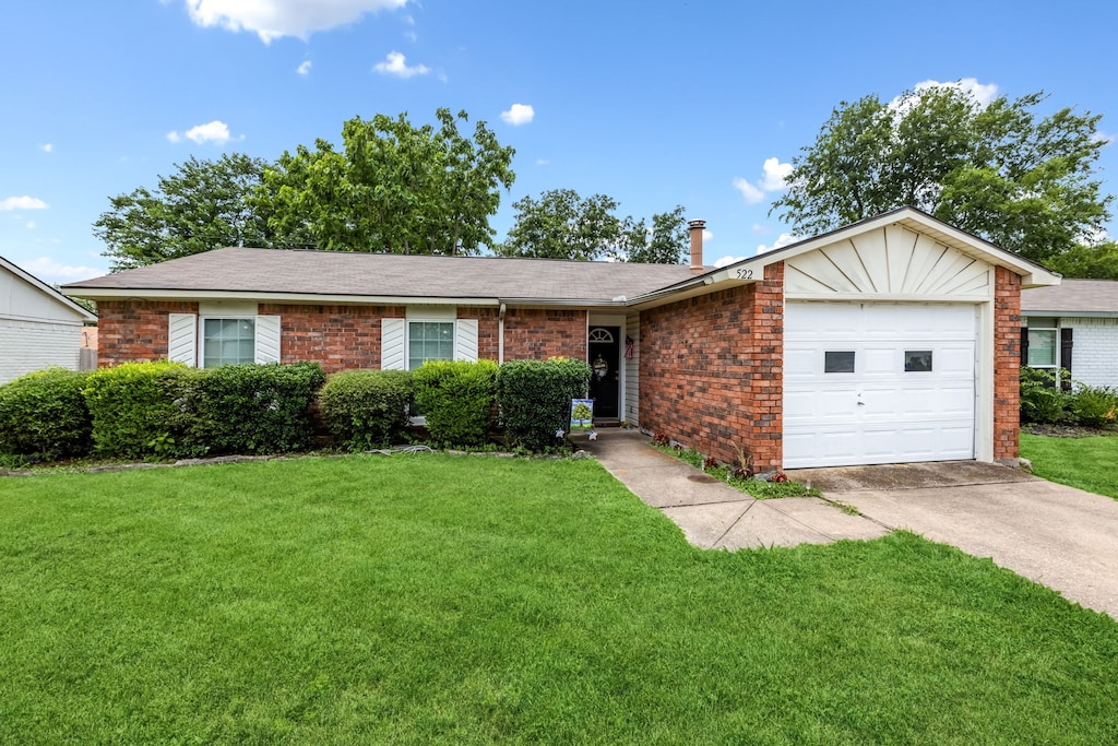 522 Hanover Dr, Allen, TX 75002 - ranch-style home with brick siding, a front lawn, and an attached garage