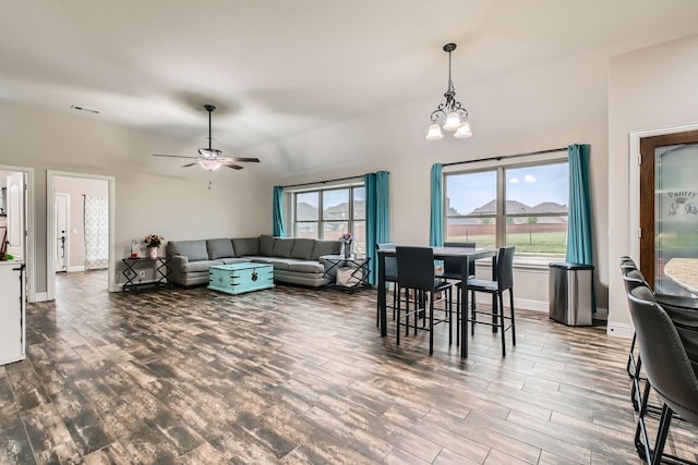 11741 Buckthorn Dr, Fort Worth, TX 76108 - living area with wood finished floors, a ceiling fan, baseboards, a chandelier, and vaulted ceiling
