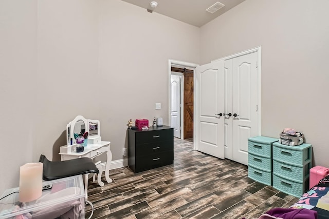 11741 Buckthorn Dr, Fort Worth, TX 76108 - bedroom with dark wood-style flooring, a closet, and baseboards