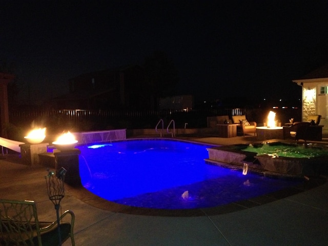 200 Sabine Creek Rd, Royse City, TX 75189 - pool at night with an outdoor fire pit, an in-ground hot tub, and a patio area