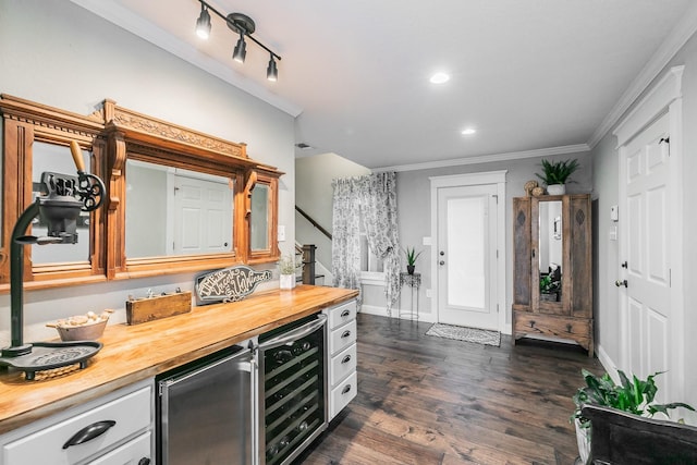 200 Sabine Creek Rd, Royse City, TX 75189 - indoor dry bar featuring wine cooler, crown molding, dark wood-style flooring, baseboards, and stairway