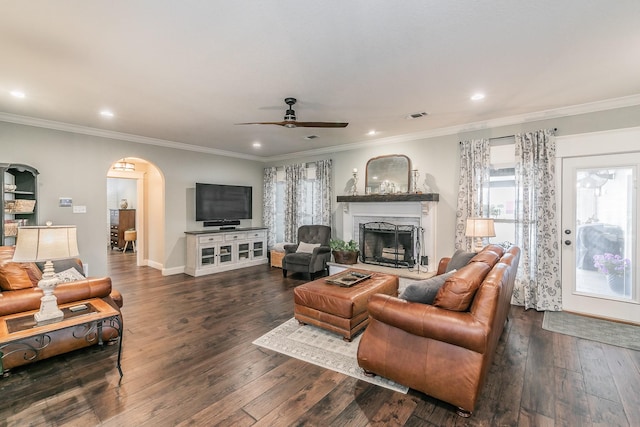 200 Sabine Creek Rd, Royse City, TX 75189 - living room featuring arched walkways, a fireplace, recessed lighting, crown molding, and a ceiling fan