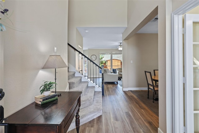 2904 Coventry Ln, Mckinney, TX 75069 - foyer with wood finished floors, ceiling fan, stairway, and baseboards