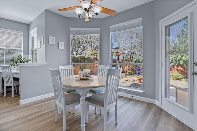 2904 Coventry Ln, Mckinney, TX 75069 - dining area featuring ceiling fan, baseboards, healthy amount of natural light, and light wood-style floors