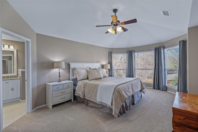 2904 Coventry Ln, Mckinney, TX 75069 - bedroom featuring light colored carpet, lofted ceiling, ensuite bathroom, baseboards, and ceiling fan