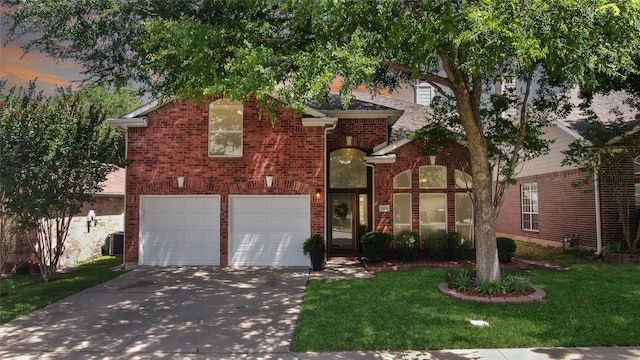 2904 Coventry Ln, Mckinney, TX 75069 - view of front of house featuring brick siding, driveway, a lawn, a garage, and central AC