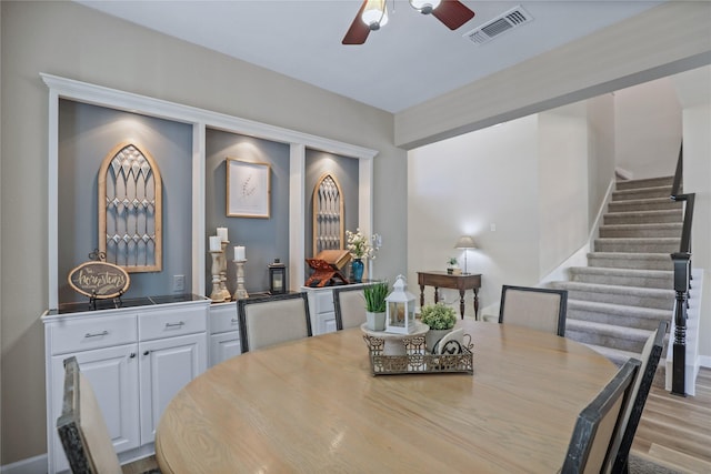 2904 Coventry Ln, Mckinney, TX 75069 - dining area with ceiling fan, stairs, and wood finished floors