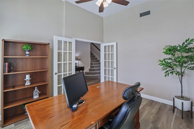 2904 Coventry Ln, Mckinney, TX 75069 - office with ceiling fan, wood finished floors, baseboards, and a towering ceiling