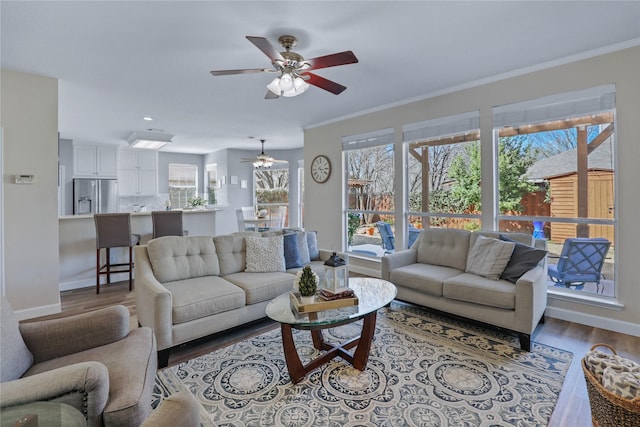 2904 Coventry Ln, Mckinney, TX 75069 - living area featuring a ceiling fan, wood finished floors, baseboards, crown molding, and recessed lighting