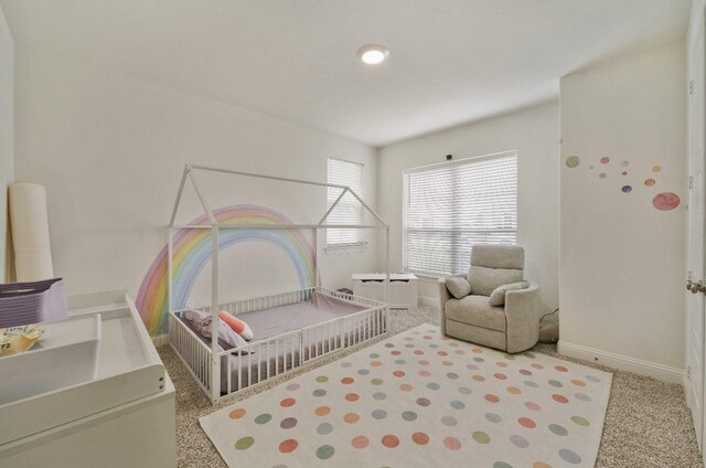 2414 Seth Dr, Midlothian, TX 76065 - carpeted bedroom featuring baseboards and a nursery area