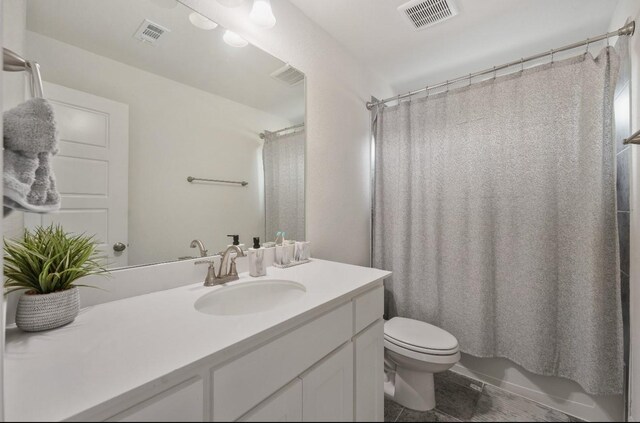 2414 Seth Dr, Midlothian, TX 76065 - full bathroom featuring vanity, tile patterned flooring, toilet, and shower / tub combo