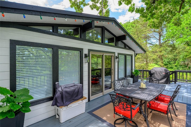 207 Wales Dr, Pottsboro, TX 75076 - wooden terrace with outdoor dining area and a grill