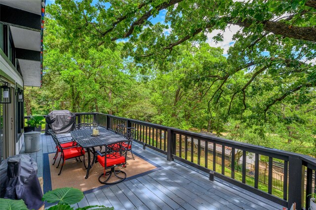 207 Wales Dr, Pottsboro, TX 75076 - wooden deck with outdoor dining space and area for grilling