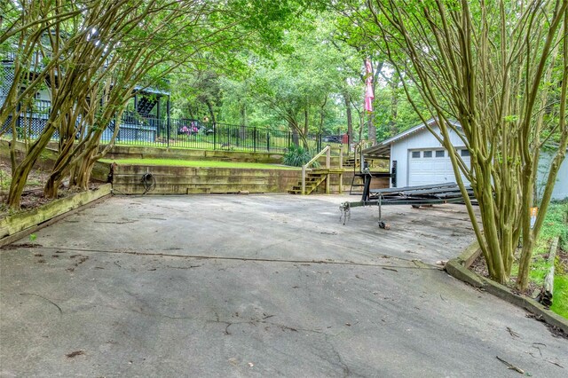 207 Wales Dr, Pottsboro, TX 75076 - view of patio with an outbuilding, a detached garage, and stairs